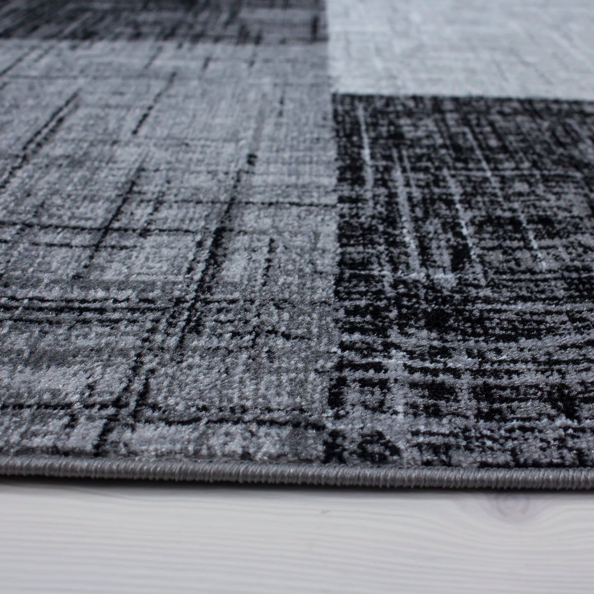 Modern Geometric Patchwork Area Carpet | Black