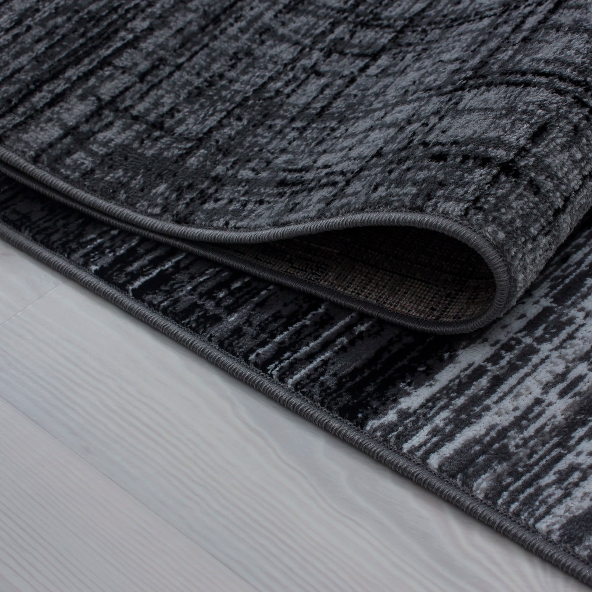 Modern Geometric Patchwork Area Carpet | Black