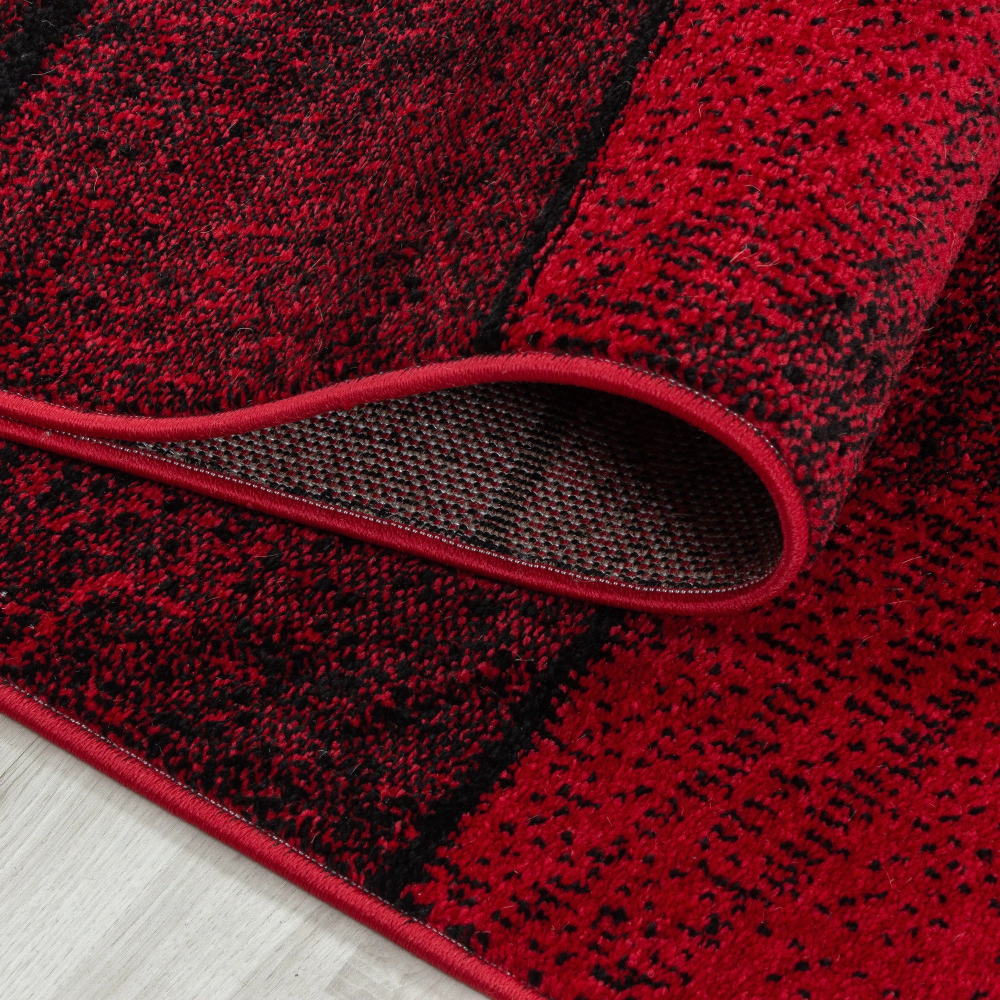 Geometrischer Mosaikteppich in Rot