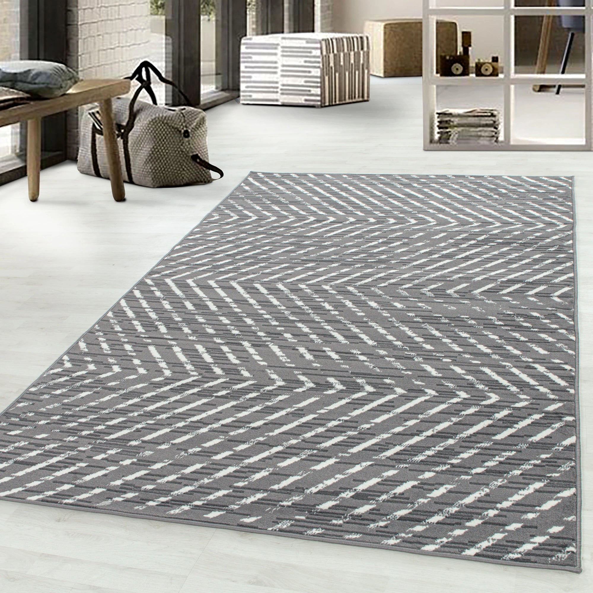 Geometrischer Rautenteppich in Grau
