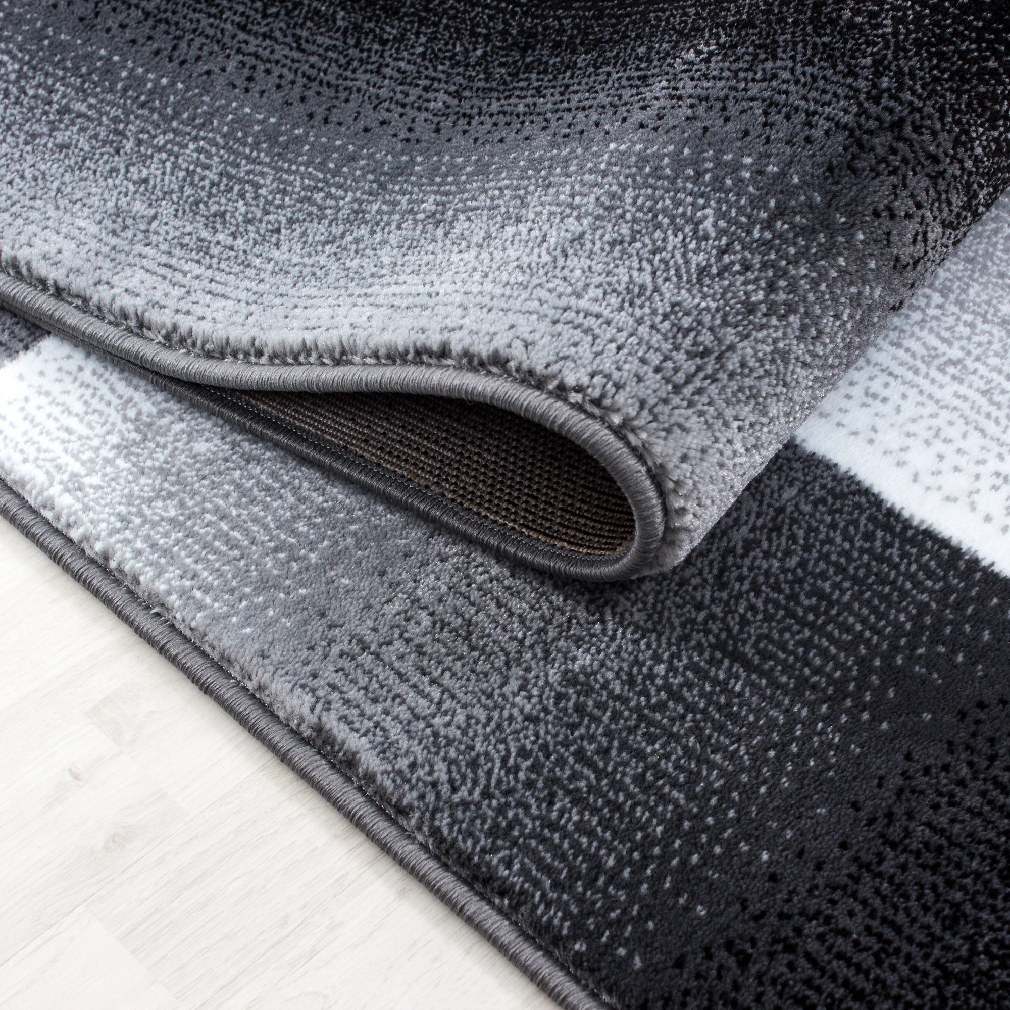abstrakt-karierter Plaid Teppich Schwarz