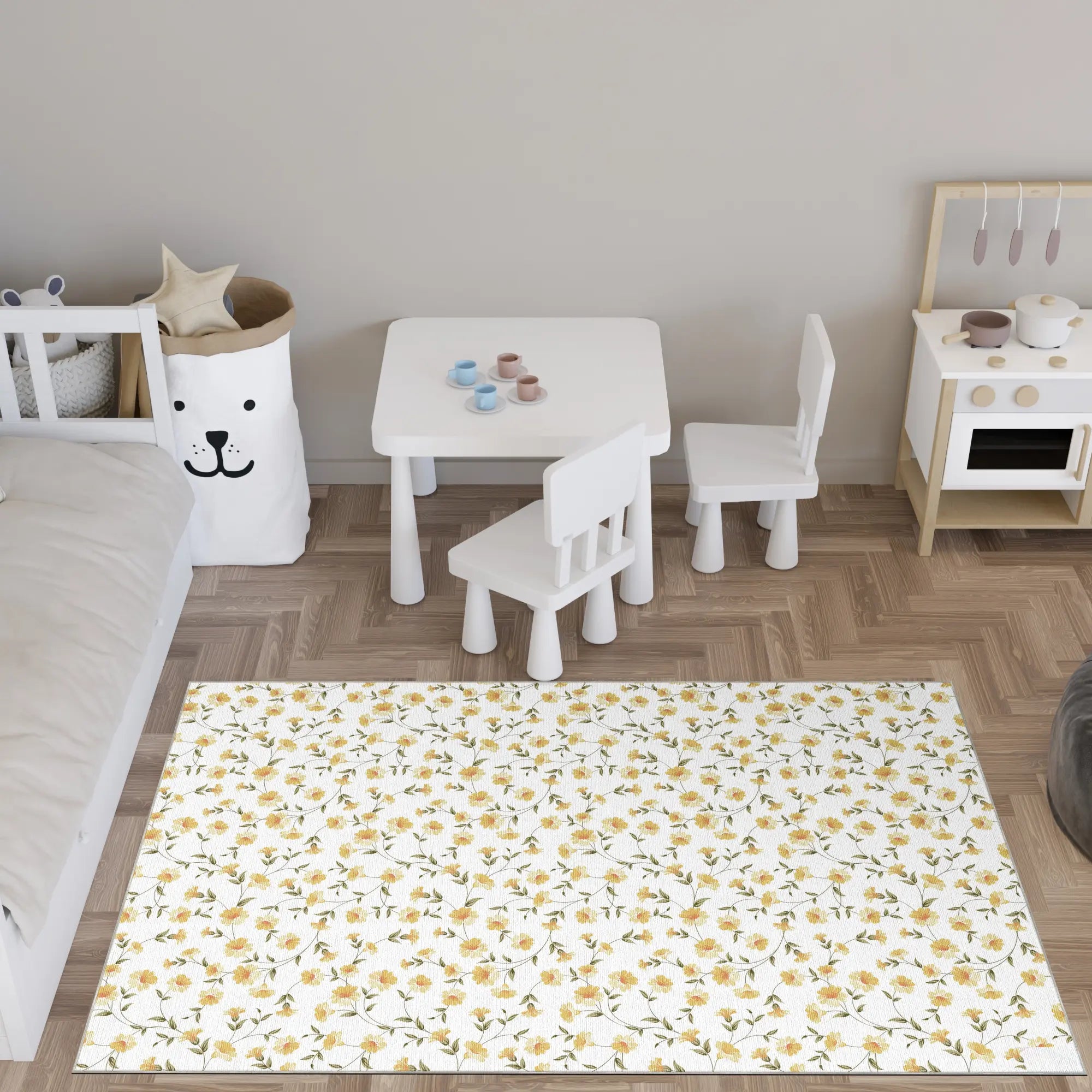 Children's play area with a floral rug, table, and chairs on a wooden floor.