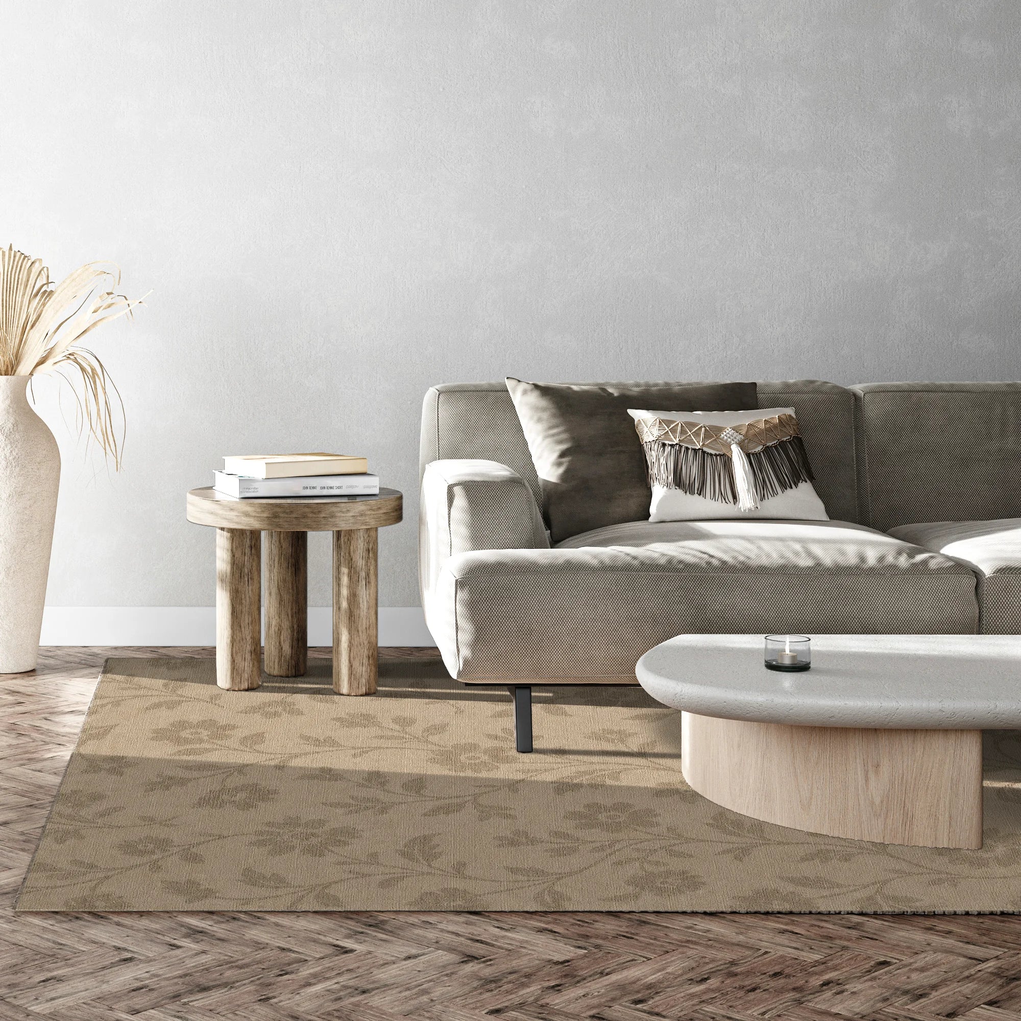 Modern living room with a gray sofa, wooden side table, and round coffee table.