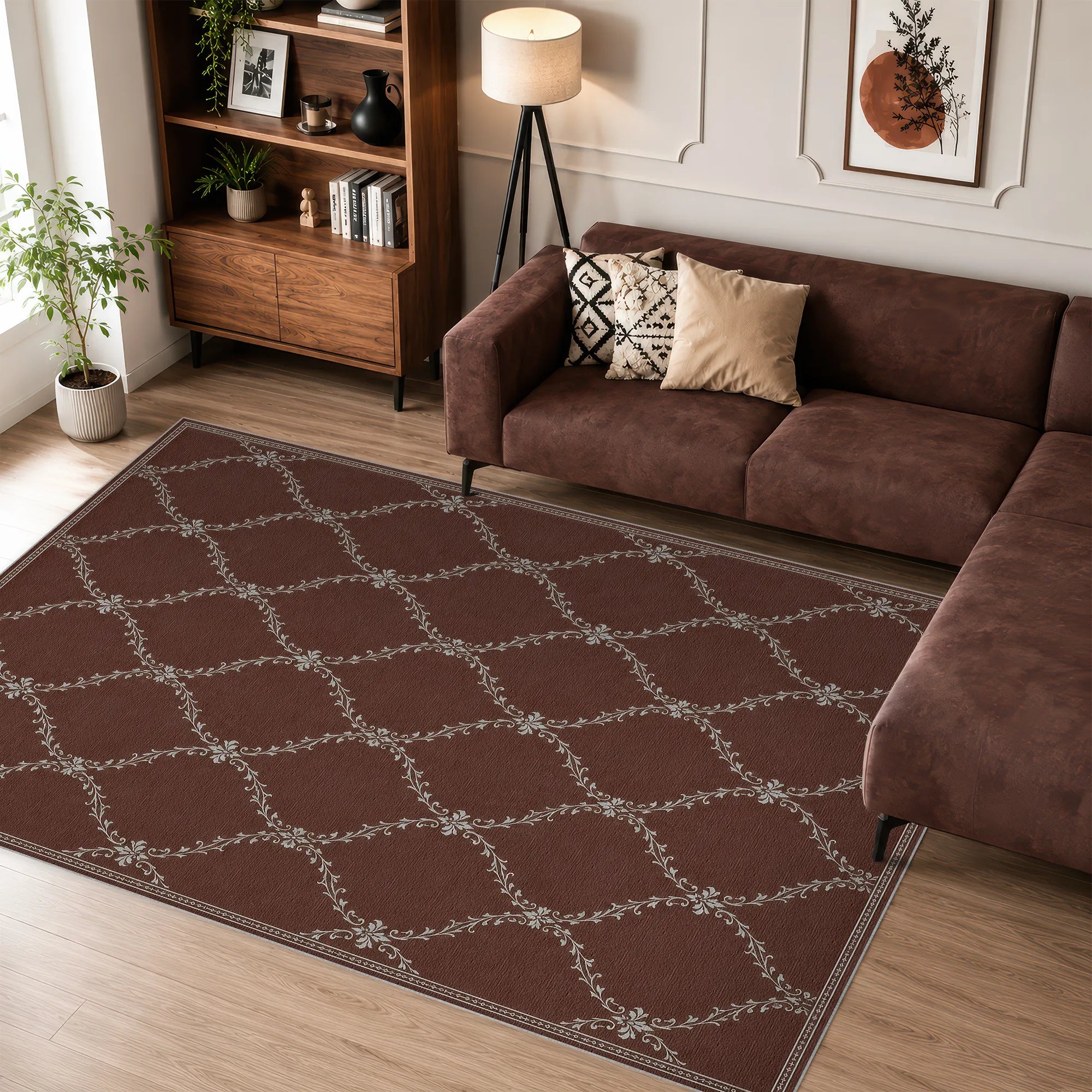 A large rectangular lattice area rug in dark brown with a repeating light beige trellis pattern, styled in a modern living room next to a brown sectional sofa.
