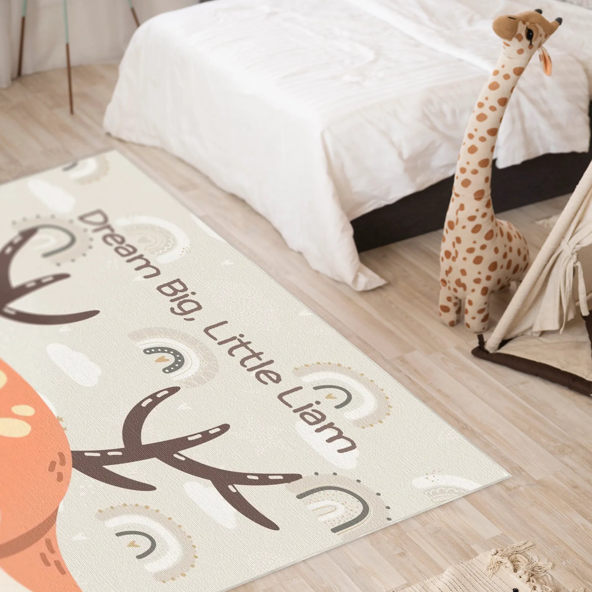 Children's room with a rug featuring custom text and a giraffe toy.